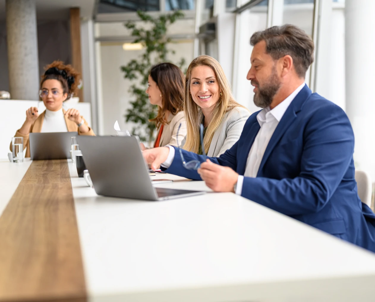 Colleagues discussing in modern office